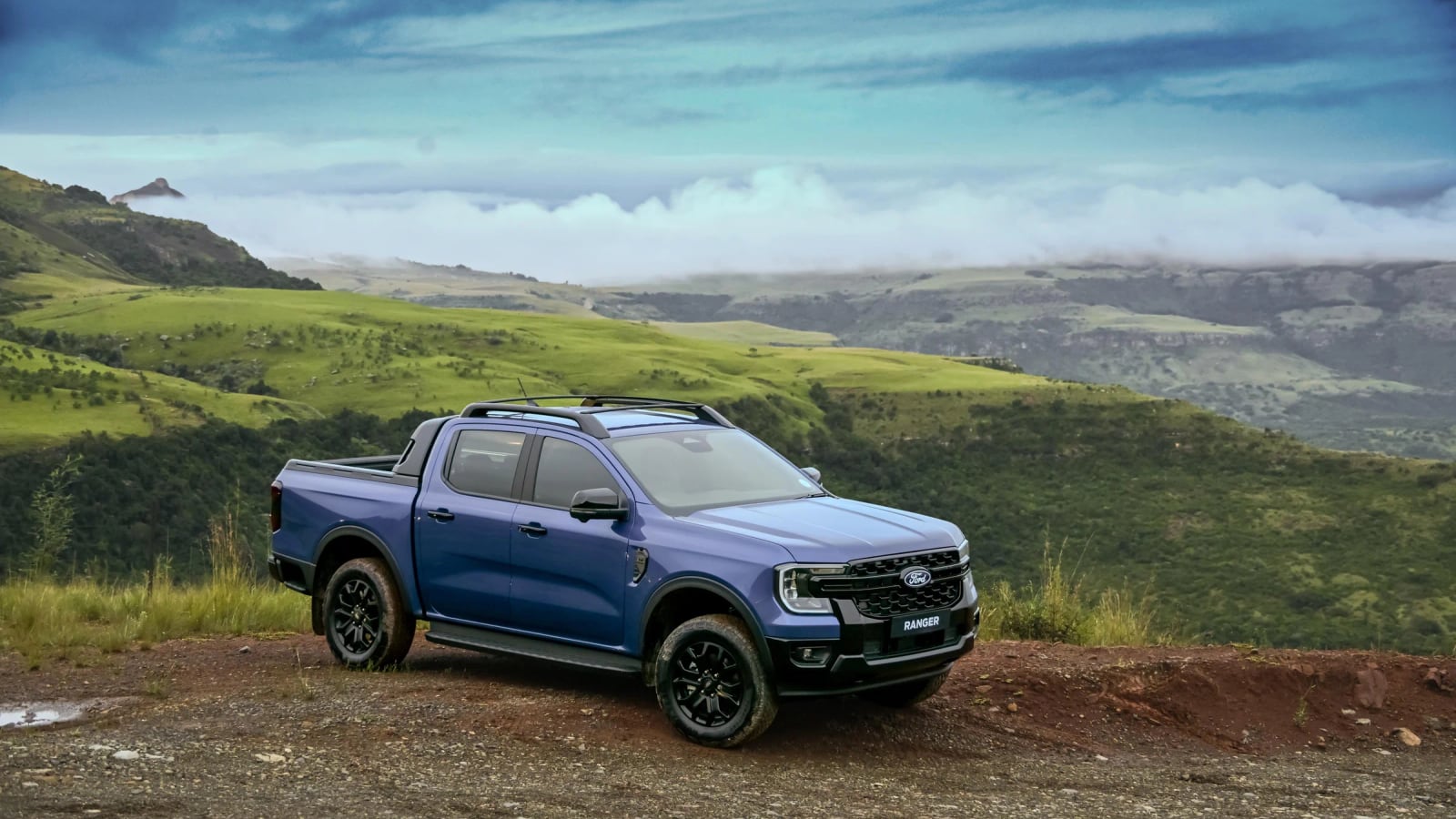 A Ford Ranger double cab parked on a hillside in the Drakensberg foothills