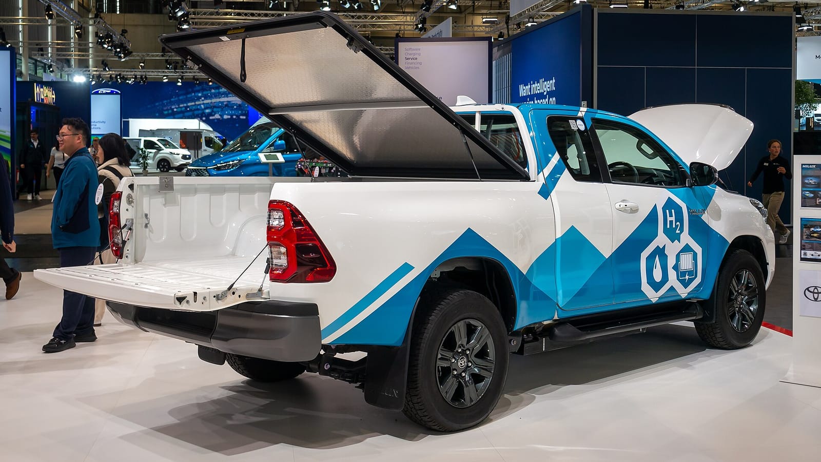 Rear three-quarter view of the Toyota Hilux FCEV prototype with the tailgate down and load bed cover raised